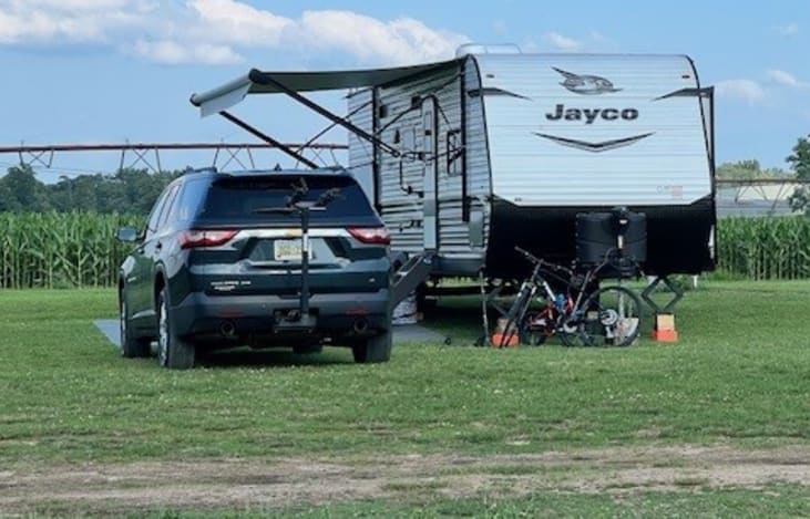 Camper in Use at Campsite,  Full Hook Up Option