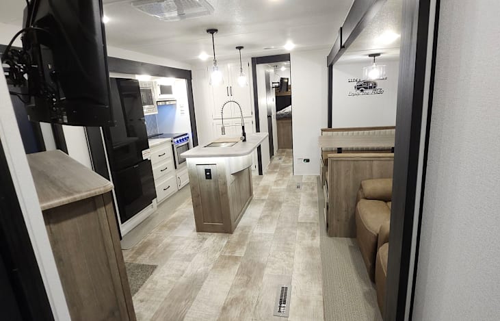 The island kitchen, living room, and dinette area. The opposing slides really opens up this area.