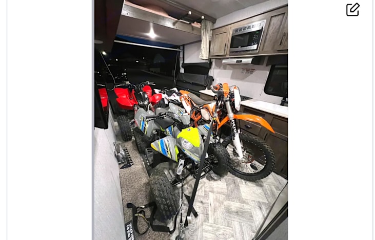 Garage has plenty of room for the toys.
Plenty of floor hooks for tie downs to keep them sturdy while transporting.