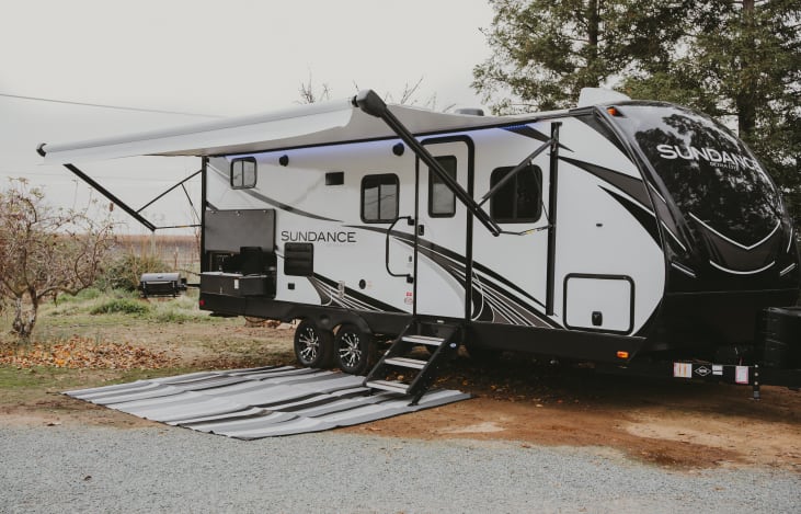 20' awning with LEDs, outdoor bluetooth speakers, heavy duty steps, FULL outdoor kitchen w/sink.