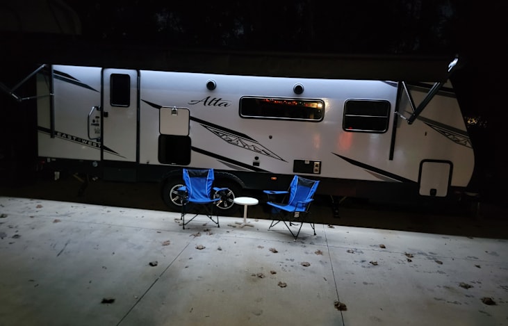Outdoor lounge area with Fridge and awning lights and outdoor speakers for those relaxing evenings