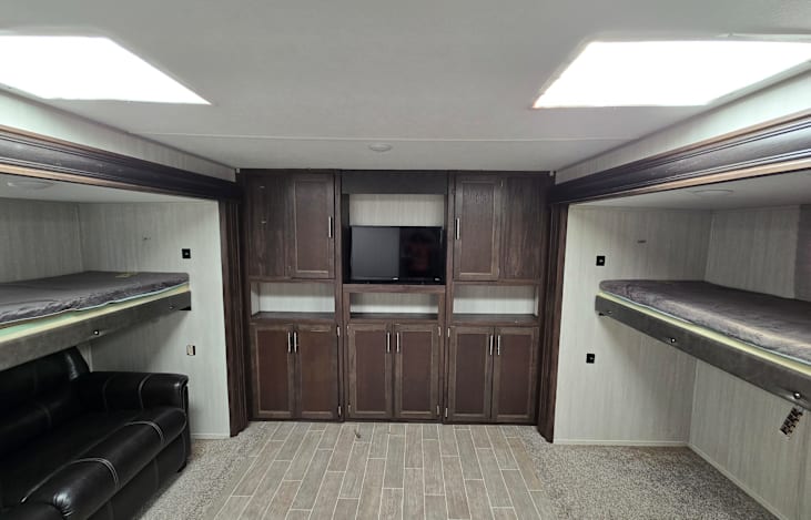 Huge Bunkhouse! This bunkhouse makes this camper ideal for kids! If you have a rainy day. No worries...plenty of room for playing inside or watching a movie!