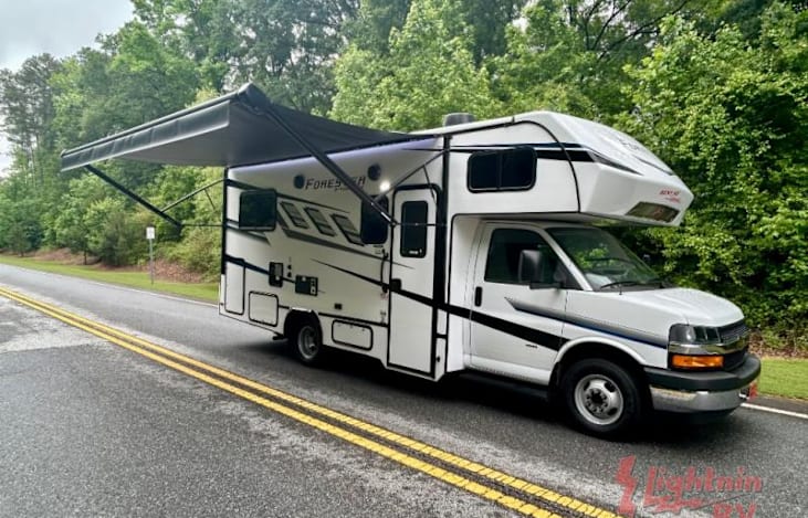 Passenger side view with electronic awning out.
