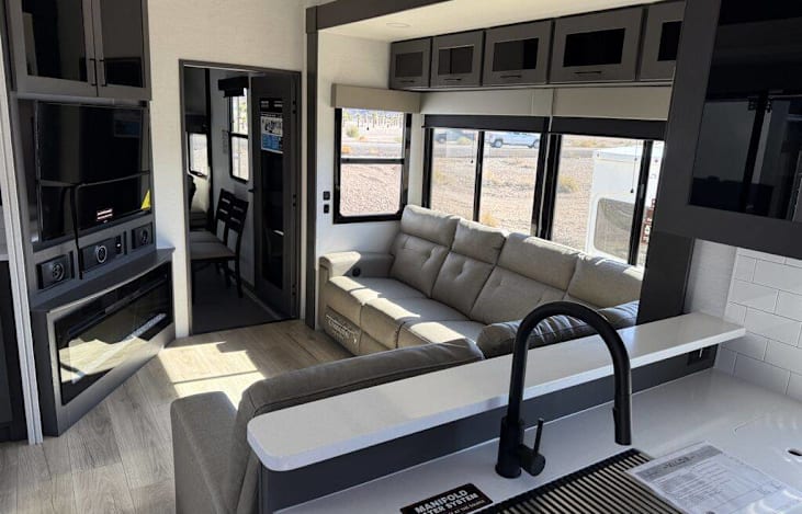 Living space with fireplace and Sectional