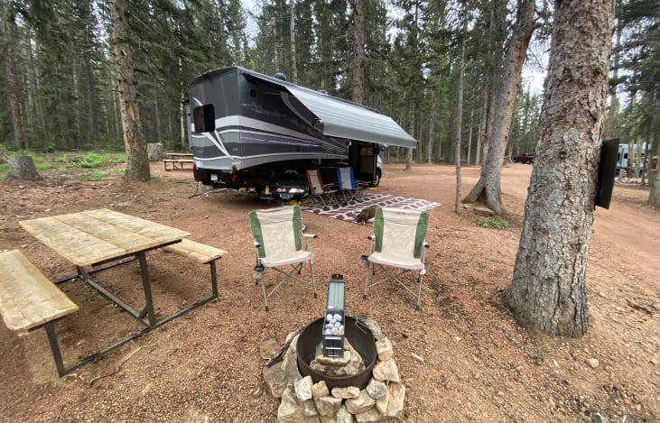 Ready for camping, Chairs, Rug, BBQ Grill,  propane Fireplace all INCLUDED! You must supply your own dog LOL