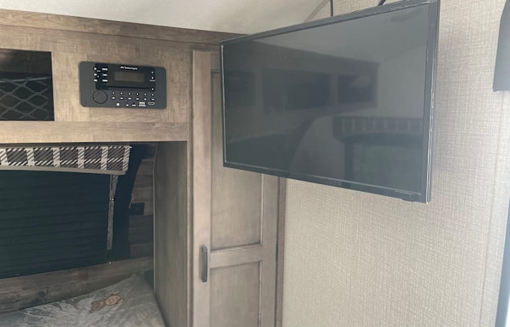 DVD player(box of DVDs available), TV, blue tooth connection to speakers inside and outside.