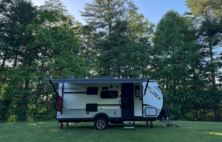 This cute little guy is easy to tow and the perfect size for a family of 4! Bike rack and solar panels, outdoor shower and outdoor kitchen too.