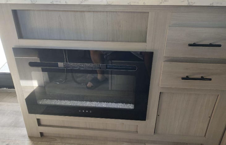 Electric Fireplace, 120 Volt plug in (cord included) or generator (not included) required.