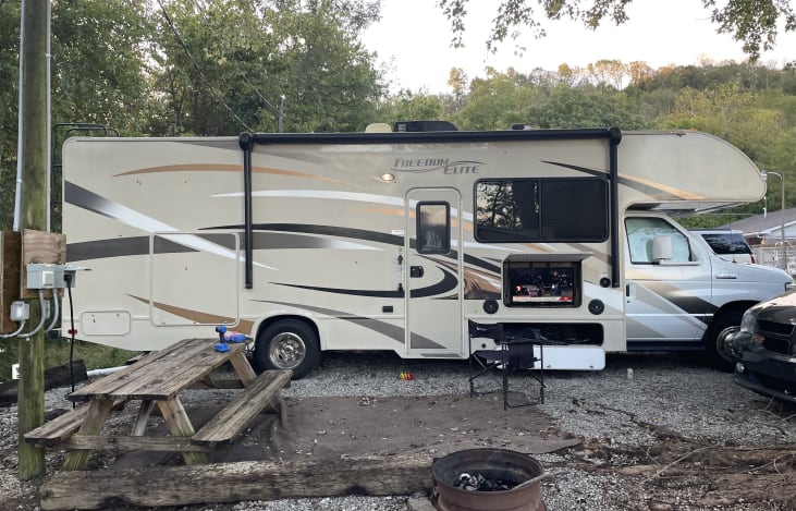 Outdoor kitchen and entertainment area with awning.  Plenty of storage!