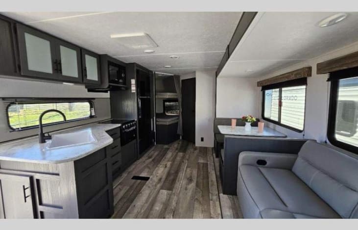 Plenty of room for family gatherings inside the camper with the restroom in the back next to the bunk beds.
