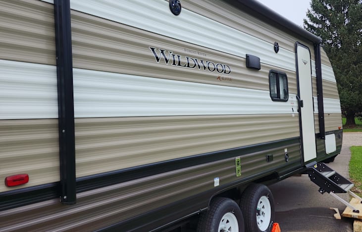 side of camper with awning in