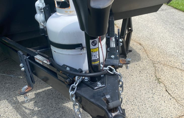 Automatic jack makes hooking-up and leveling the camper a breeze. Propane tank also included for heat and stove.