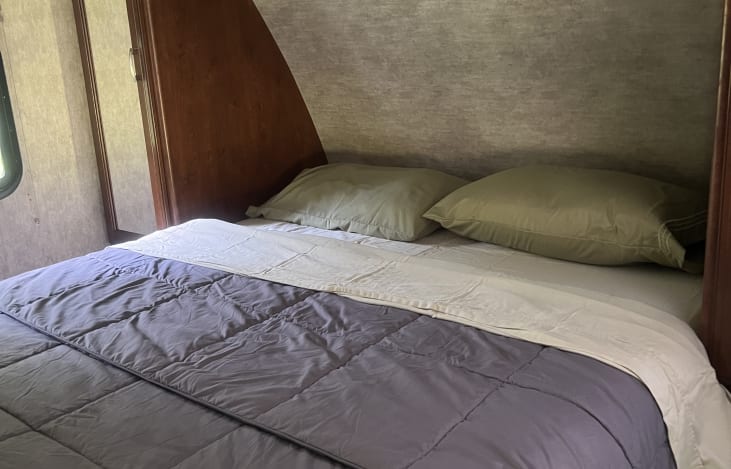 New queen mattress, sliding doors on both sides of the bed.