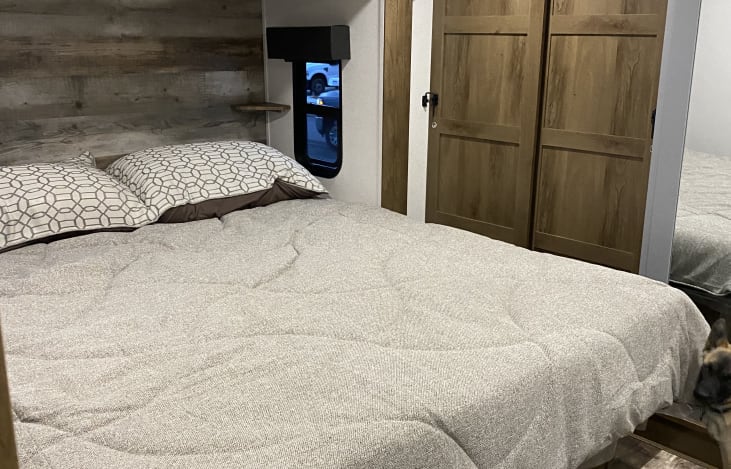 Bed sleeps east to west and is queen size.  Lots of closet space and storage under the bed.