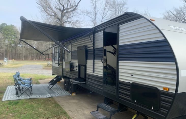 Motorized Awning. Exterior entertainment system with outdoor kitchen