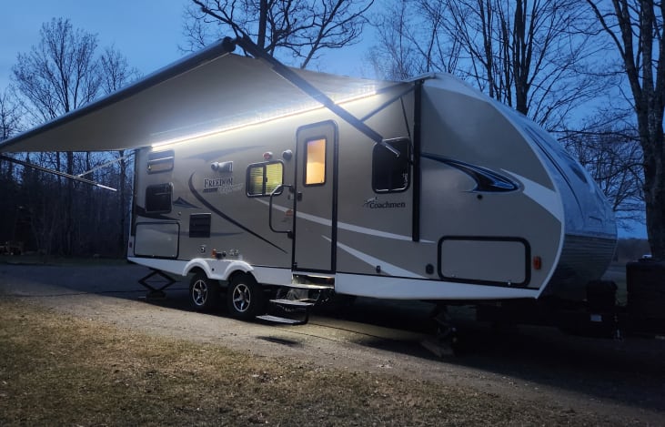 The Gulf Hagas with its awning extended and bright LED lighting.