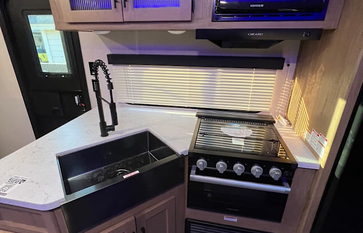 Kitchen sink, stove and microwave