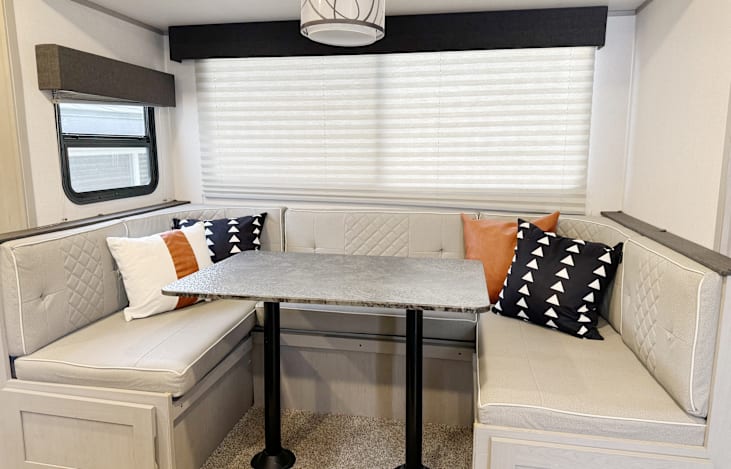 Dining area seats 6 people comfortably. Storage cabinets under each bench are deep and hold a great deal of supplies.
