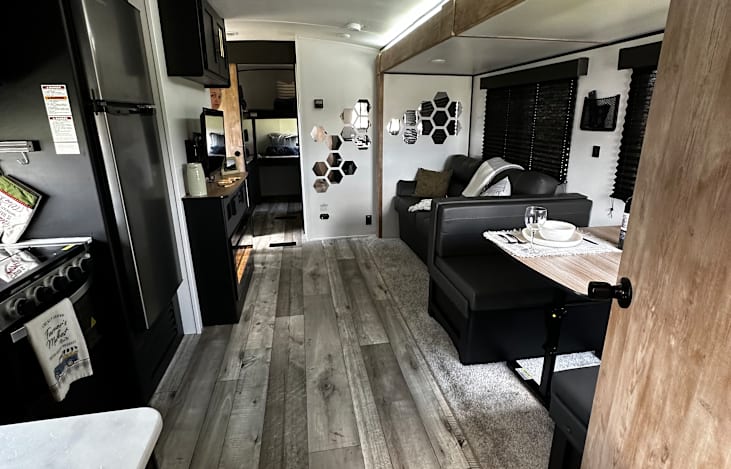 Couch and dining area both convert to sleeping areas for additional sleeping space.
