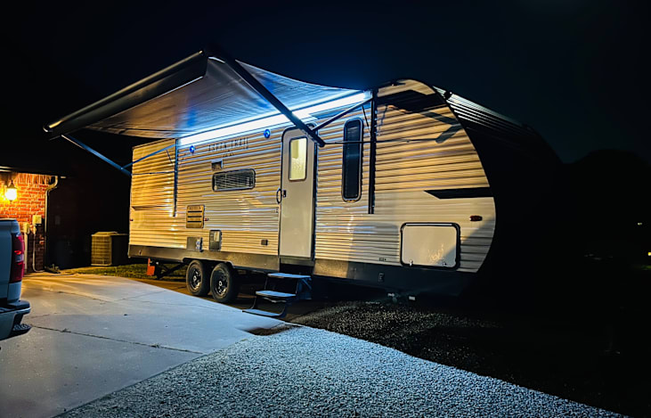 26 ft. Bunkhouse, one super slide, 3 full beds, pullout couch and a dinning table that converts to a bed. Awning complete with lighting and outdoor/outdoor radio.
