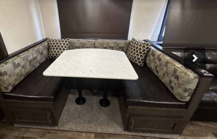 Wrap Around dinette table that can be made into a bed.