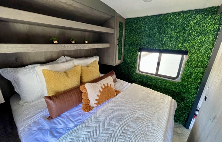 Queen size bed with foam mattress topper