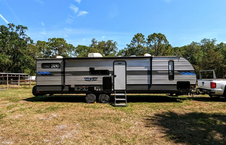 Massive 18ft awning covers the outdoor cooktop so you can grill out rain or shine.