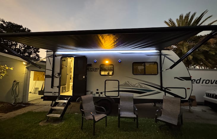 Crazy Summer Nights in Bearly Behaving. Power Awning with LED Lighting, Outdoor refrigerator and barbecue grill. Blue tooth speaker.