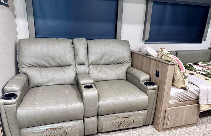 Recliners and booth dinette made into twin-sized bed.