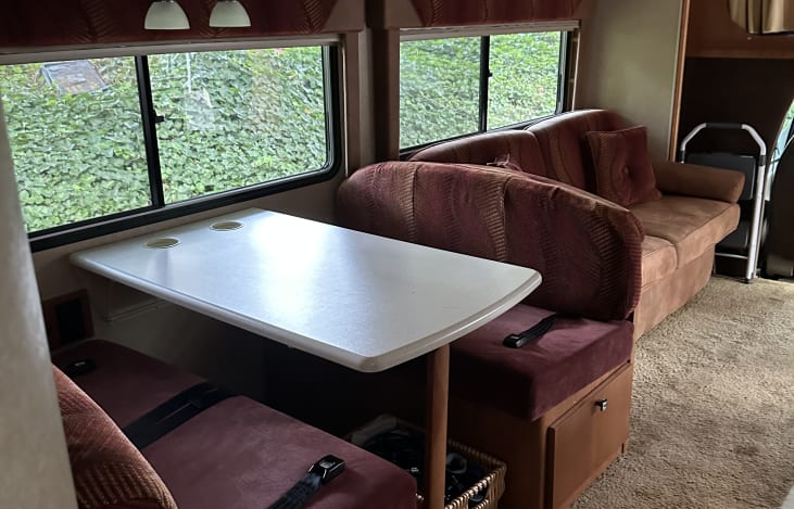 Dining or work area with comfortable seating, handy electrical outlet and great views.  Seat belts included for traveling.
