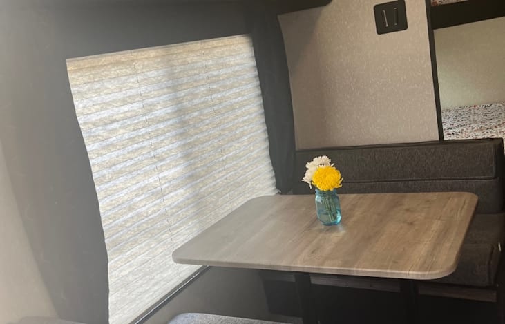 Comfy eating area with large window
Folds down for additional sleeping space
