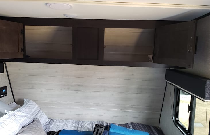 Above bed storage. Ideal for backpacks and duffel bags.