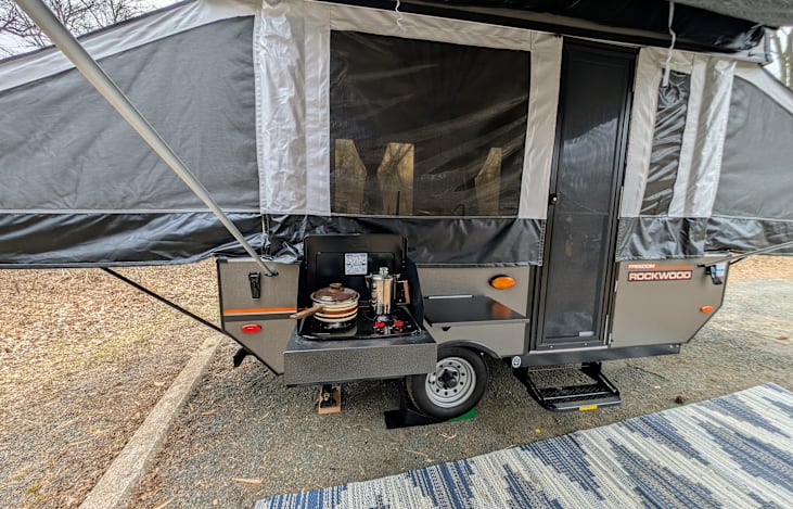 Outside burner with side table. Coffee pot and cooking pot included. However, to include the outside burner, please see add-ons.