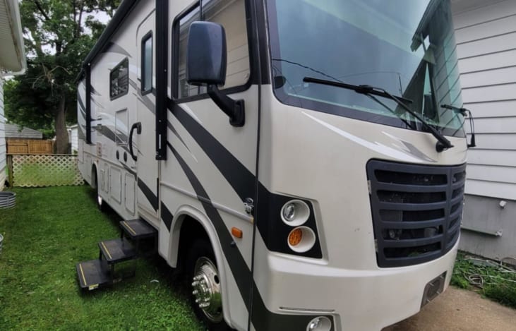 Exterior of RV, it is just under 32' long, 12' 2'' tall and 8' 4'' wide.
