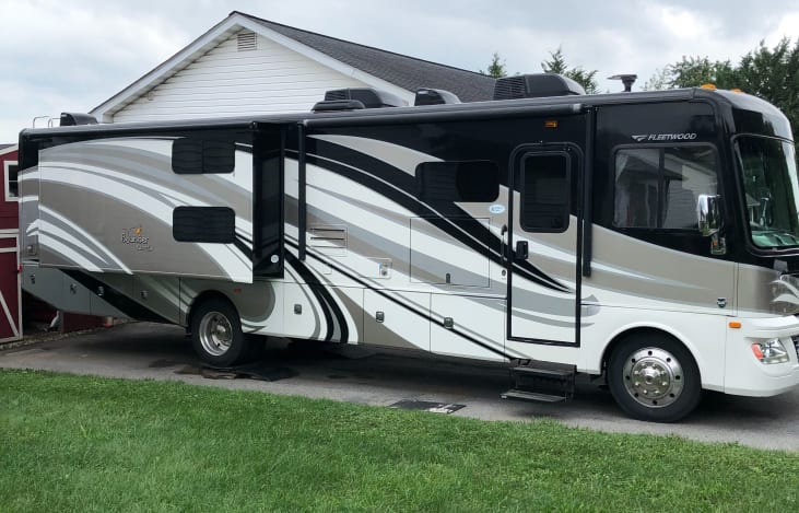 Full body paint makes this RV stand out in style .