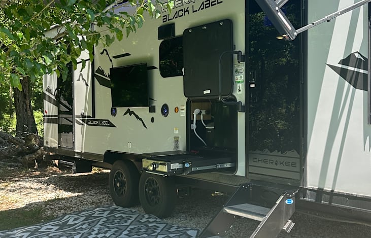 Outdoor TV mount, mini fridge, gas grill, ice maker, and shower