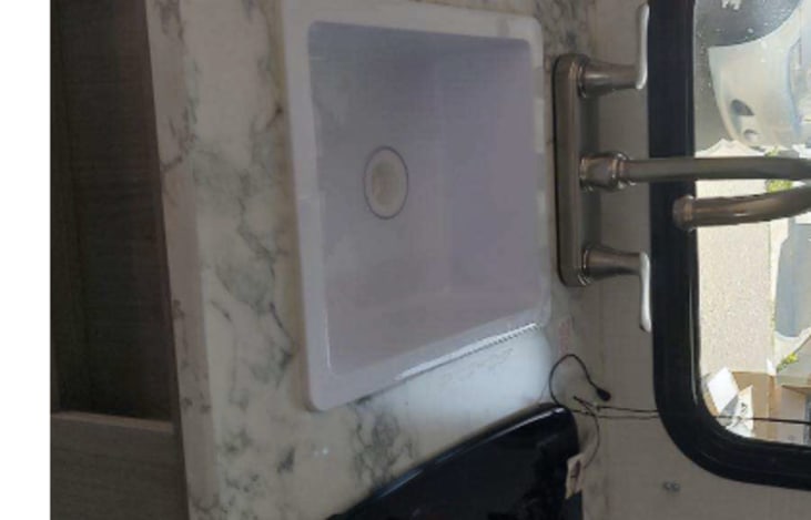 Kitchen sink... sideways for reasons unknown, it is upright in the unit.