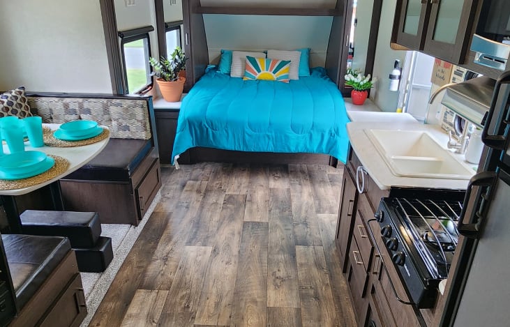 Main area looking back at kitchen on right, dinette left and murphy bed front
