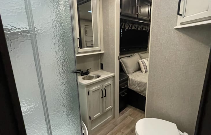 Bathroom! Stand Up Shower w/ Glass Doors! Toilet with RV Bidet! Access from main cabin or private access from master bedroom!