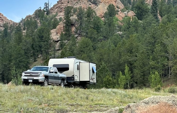 The size makes it easy to tow, the slide out makes it roomy inside. I tow it with my 1/2 ton Silverado with no problem.