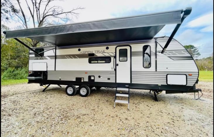 Has a single entry door with an outdoor kitchen that is able to be used. The outdoor kitchen has a two-burner stove and a small dorm refrigerator, great for drinks to prevent going in and out.