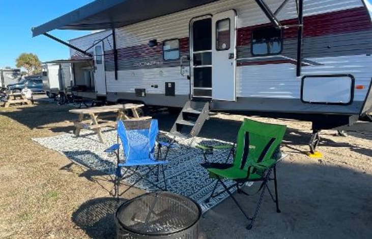 2 doors and outside kitchen; rug and 4 camp chairs included in rental.