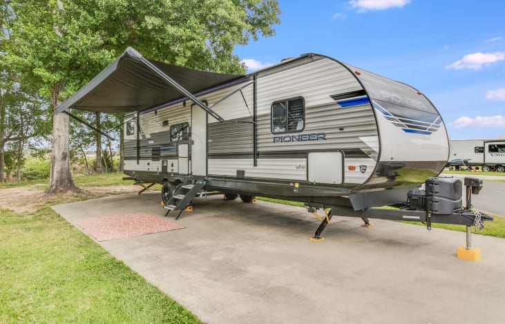 Enjoy your time outside at every campground with the outdoor lighted area under the awning. Bring your chairs to make the perfect seating area.